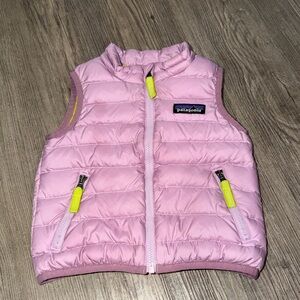 Patagonia lilac puffer vest with neon yellow lining